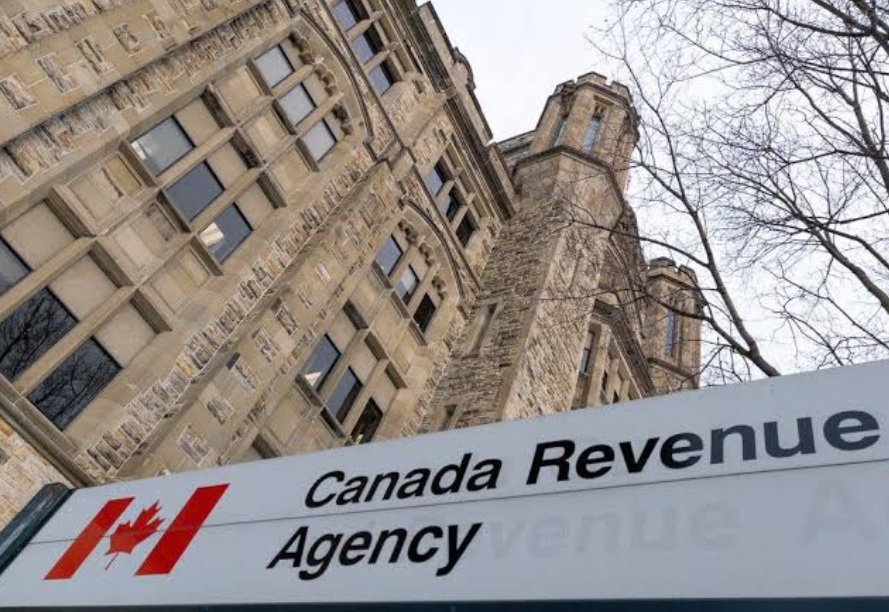 Canada Revenue Agency sign in front of a historic stone building