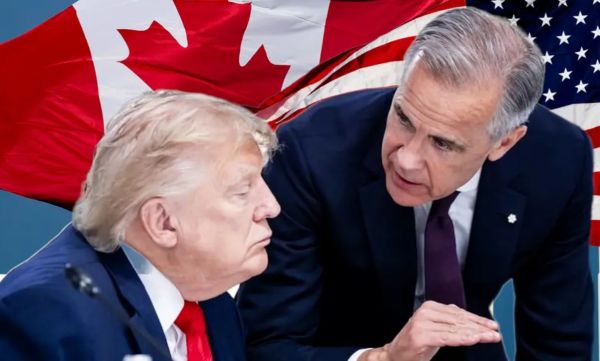 Two men in suits lean toward each other in a serious discussion, with a U.S. flag backdrop.
