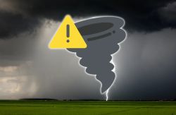 Stormy landscape with a tornado funnel and lightning on a flat field, with a yellow warning icon in the foreground.