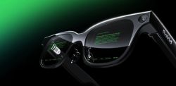 Black smart glasses with green text on the lenses and Rokid branding on the arm, shown against a dark gradient background.