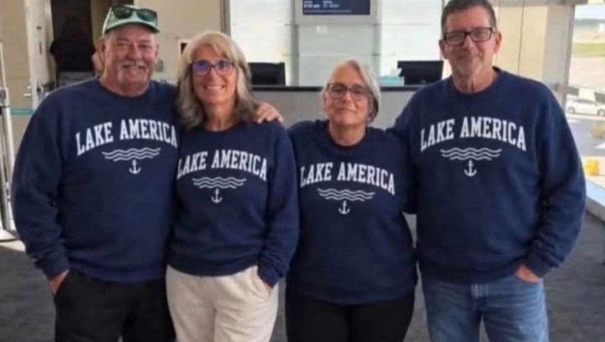 озеро америка сша | Наш Ванкувер Four adults wearing matching navy sweatshirts that read 'LAKE AMERICA' pose together indoors, smiling.