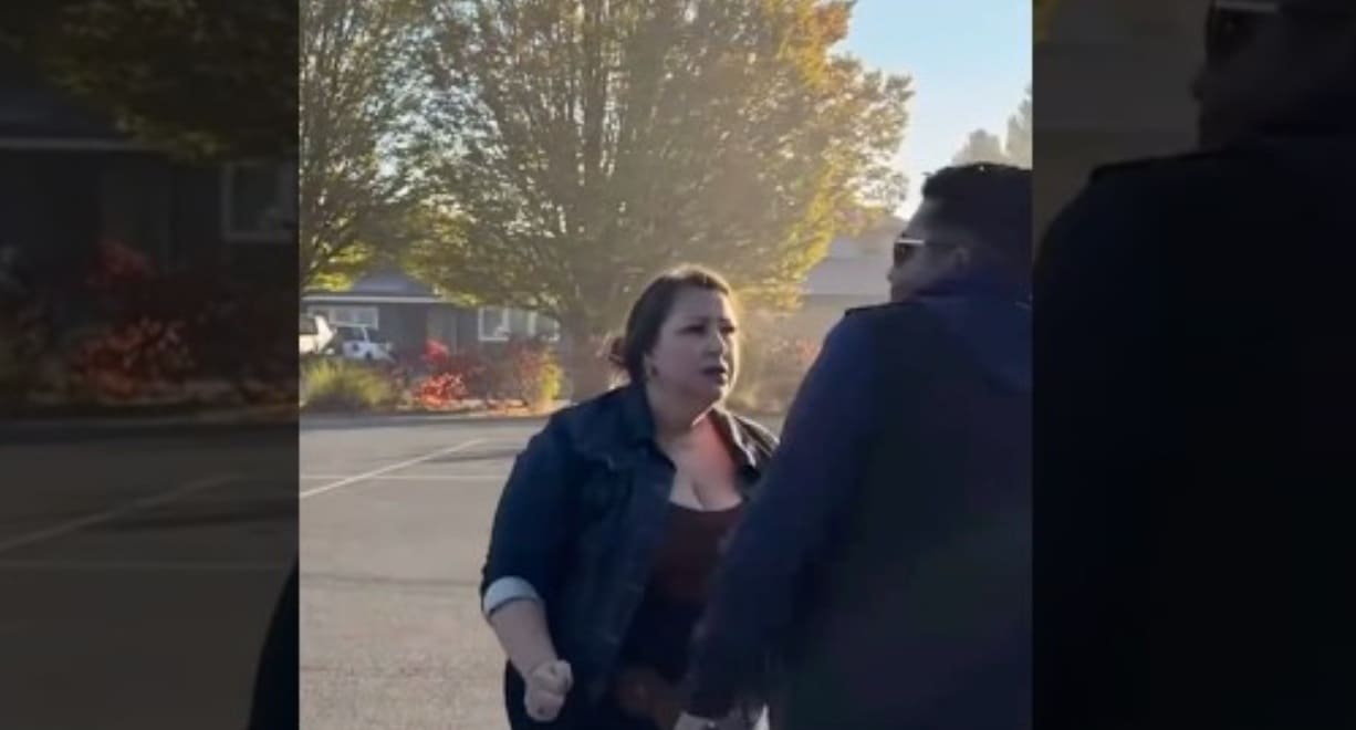 ДРАКА на парковке | Наш Ванкувер Woman in a denim jacket argues with a man in a dark hoodie in a parking lot during daytime.
