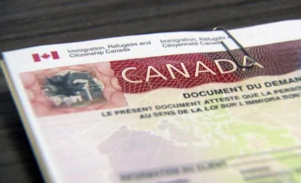 Close-up of a Canadian immigration document showing the word CANADA and official header text "Immigration, Refugees and Citizenship Canada".